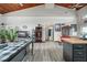 Open living space with vaulted ceilings, wood beams, and hardwood floors at 430 Magpie Ct, Kissimmee, FL 34759