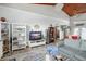 Open concept living area with vaulted ceilings and hardwood floors at 430 Magpie Ct, Kissimmee, FL 34759