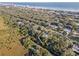 Aerial view of property location near waterway and coast at 4390 Saxon Dr, New Smyrna Beach, FL 32169