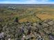 Aerial view showing property location near water and lush landscape at 4390 Saxon Dr, New Smyrna Beach, FL 32169