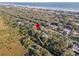Aerial view showcasing property location near the coast at 4390 Saxon Dr, New Smyrna Beach, FL 32169
