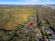 Aerial view showing property location near a road and nature at 4390 Saxon Dr, New Smyrna Beach, FL 32169
