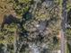Property surrounded by lush trees near a canal at 4390 Saxon Dr, New Smyrna Beach, FL 32169