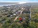 Aerial view of property location near the coast, showcasing surrounding landscape and neighborhood at 4390 Saxon Dr, New Smyrna Beach, FL 32169