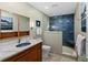 Updated bathroom with walk-in shower and modern vanity at 4390 Saxon Dr, New Smyrna Beach, FL 32169