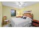 Bedroom with a wicker headboard and ceiling fan at 4390 Saxon Dr, New Smyrna Beach, FL 32169