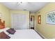 Cozy bedroom with a comfortable bed and built-in closets at 4390 Saxon Dr, New Smyrna Beach, FL 32169