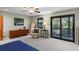 Bedroom with sliding glass doors leading to a balcony at 4390 Saxon Dr, New Smyrna Beach, FL 32169