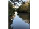 Scenic view of a peaceful canal, perfect for relaxing at 4390 Saxon Dr, New Smyrna Beach, FL 32169