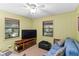 Den featuring a large TV and ample space for relaxation at 4390 Saxon Dr, New Smyrna Beach, FL 32169