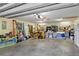 Spacious garage with ample storage and shelving at 4390 Saxon Dr, New Smyrna Beach, FL 32169