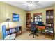 Home office features built-in shelving and window views at 4390 Saxon Dr, New Smyrna Beach, FL 32169