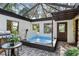 Hot tub with brick patio and outdoor grill at 4390 Saxon Dr, New Smyrna Beach, FL 32169