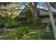 Stone house exterior, lush landscaping at 4390 Saxon Dr, New Smyrna Beach, FL 32169