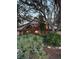 Home exterior with large windows, garden at 4390 Saxon Dr, New Smyrna Beach, FL 32169