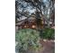 Home exterior with large windows, garden at 4390 Saxon Dr, New Smyrna Beach, FL 32169