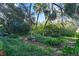 Relaxing garden area with lush plants at 4390 Saxon Dr, New Smyrna Beach, FL 32169