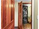 Laundry room with stackable washer and dryer at 4390 Saxon Dr, New Smyrna Beach, FL 32169