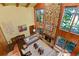 High-ceilinged living room with stone fireplace at 4390 Saxon Dr, New Smyrna Beach, FL 32169
