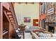 Living room features a stone fireplace, high ceilings, and wooden walls at 4390 Saxon Dr, New Smyrna Beach, FL 32169