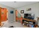 Cozy loft area with a TV, bookshelves, and a view at 4390 Saxon Dr, New Smyrna Beach, FL 32169