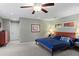 Large main bedroom with a king-size bed and ceiling fan at 4390 Saxon Dr, New Smyrna Beach, FL 32169