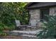 Private patio oasis with seating area at 4390 Saxon Dr, New Smyrna Beach, FL 32169