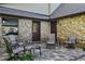 Relaxing patio with stone wall & seating at 4390 Saxon Dr, New Smyrna Beach, FL 32169