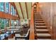 Wooden staircase with a clock, leading to the upper level at 4390 Saxon Dr, New Smyrna Beach, FL 32169