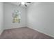 Spacious bedroom with arched window and neutral decor at 440 Macgregor Rd, Winter Springs, FL 32708