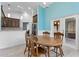 Cozy dining area with wooden table and chairs, and access to a patio at 440 Macgregor Rd, Winter Springs, FL 32708