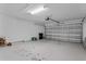 Attached garage with overhead door and storage at 440 Macgregor Rd, Winter Springs, FL 32708