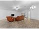 Living room featuring hardwood floors, leather furniture, and a ceiling fan at 440 Macgregor Rd, Winter Springs, FL 32708