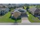 An aerial view showcasing a single-Gathering home with a two-car garage at 5106 Nw 35Th Lane Rd, Ocala, FL 34482