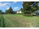 Spacious backyard with manicured lawn and screened patio at 5106 Nw 35Th Lane Rd, Ocala, FL 34482