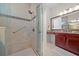 Walk-in shower with built-in seat and grab bar, plus a modern vanity at 5106 Nw 35Th Lane Rd, Ocala, FL 34482