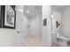 Clean bathroom with toilet, sink, and tiled floor at 5106 Nw 35Th Lane Rd, Ocala, FL 34482