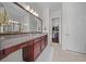 Elegant bathroom with double sinks, walk-in shower, and large closet at 5106 Nw 35Th Lane Rd, Ocala, FL 34482