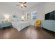 Bedroom with a double bed, blue dresser, and yellow chair at 5106 Nw 35Th Lane Rd, Ocala, FL 34482