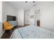 Spacious bedroom with a double bed, dresser, and en-suite bathroom at 5106 Nw 35Th Lane Rd, Ocala, FL 34482
