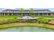 Community clubhouse with patio overlooking pond at 5106 Nw 35Th Lane Rd, Ocala, FL 34482