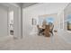 Sunlit dining room with a round table and wicker chairs at 5106 Nw 35Th Lane Rd, Ocala, FL 34482