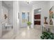 Bright entryway with view into living room and laundry room at 5106 Nw 35Th Lane Rd, Ocala, FL 34482