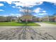 House exterior with a tree and paved driveway at 5106 Nw 35Th Lane Rd, Ocala, FL 34482