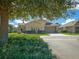 Exterior view of a charming house with landscaping and a two car garage at 5106 Nw 35Th Lane Rd, Ocala, FL 34482