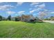House exterior showcasing a well-manicured lawn and landscaping at 5106 Nw 35Th Lane Rd, Ocala, FL 34482