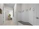 Clean hallway with built-in bench and coat hooks at 5106 Nw 35Th Lane Rd, Ocala, FL 34482