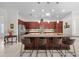 Kitchen features large island, granite countertops, and dark wood cabinets at 5106 Nw 35Th Lane Rd, Ocala, FL 34482