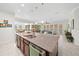 Open concept kitchen with large island overlooking Gathering room at 5106 Nw 35Th Lane Rd, Ocala, FL 34482