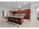Spacious kitchen with island, granite countertops, and stainless steel appliances at 5106 Nw 35Th Lane Rd, Ocala, FL 34482